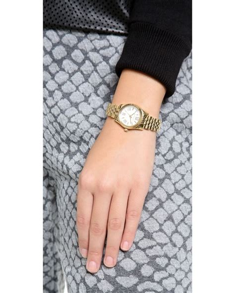 @paige b: it’s called the petite lexington pavé two-tone watch|lexington pave gold tone.